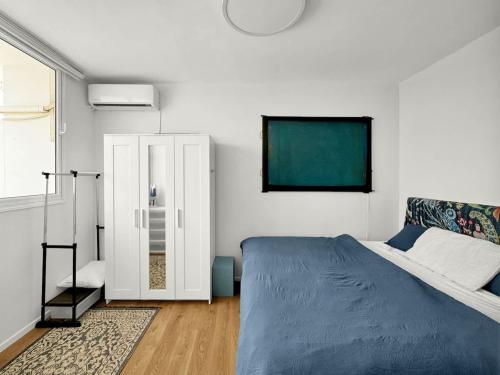 Postel nebo postele na pokoji v ubytování Beachfront Paradise Penthouse