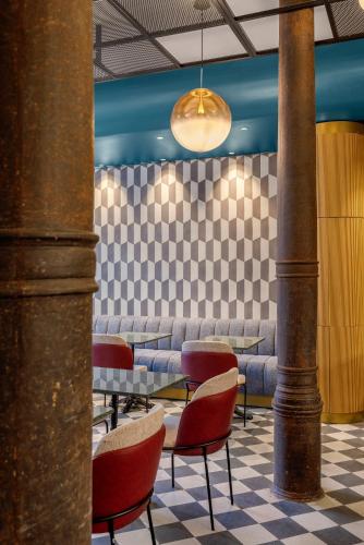 a waiting room with couches and tables and chairs at LOCANDA SANTAMARINA Dimora di Charme in Palermo