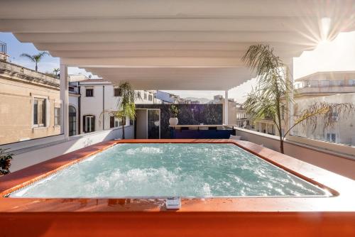 an indoor pool on the roof of a house at LOCANDA SANTAMARINA Dimora di Charme in Palermo