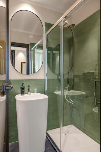 a bathroom with a glass shower and a sink at LOCANDA SANTAMARINA Dimora di Charme in Palermo