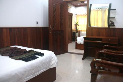 Ένα ή περισσότερα κρεβάτια σε δωμάτιο στο Shining Angkor Apartment Hotel