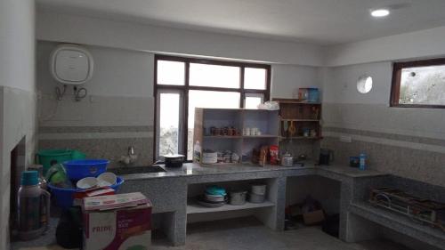 Kuchyň nebo kuchyňský kout v ubytování Hotel Thangshing In