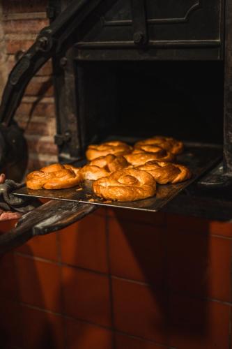a bunch of loaves of bread in an oven at S'Hort de Son Caulelles - Adults Only in Marratxí 