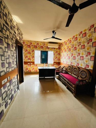 a large living room with a couch and a sink at Panama & Panama Hotel and Restaurant in New Town
