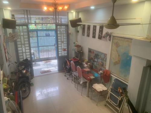 a room with a desk and a table with chairs at Room4 Double-Bed Private Bath in Ho Chi Minh City
