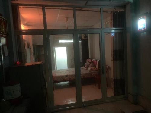 a view of a room with a bed through a window at Room4 Double-Bed Private Bath in Ho Chi Minh City