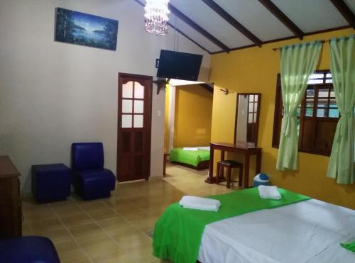 Cama o camas de una habitación en Cabañas Yakuruna
