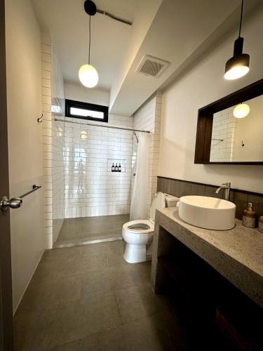 a bathroom with a toilet and a sink and a shower at Stylish Studio in Prime Sukhumvit-Next to BTS Nana in Bangkok