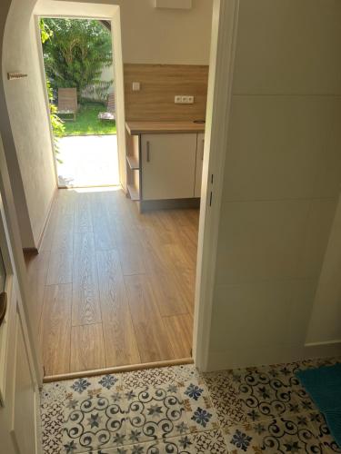 an empty hallway with a door leading to a desk at Penzion Marcipánka in Třeboň