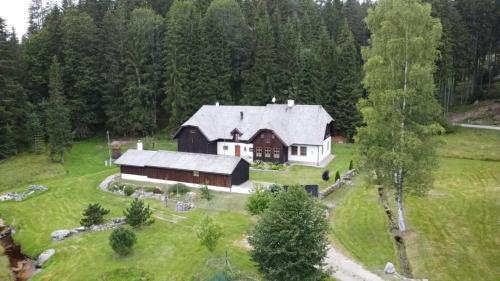 an aerial view of a large barn in a field at Hájovna u Jindřicha in Nová Pec