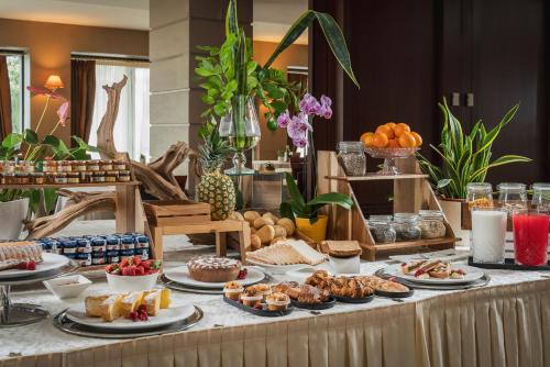 a buffet with various types of food on a table at Grand Hotel San Marino in San Marino