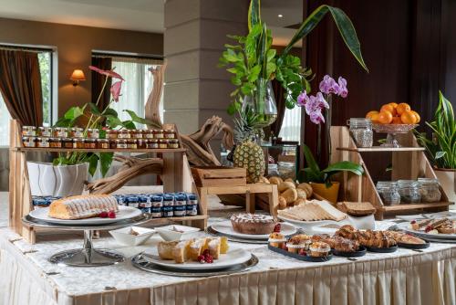 a buffet with desserts and pastries on a table at Grand Hotel San Marino in San Marino