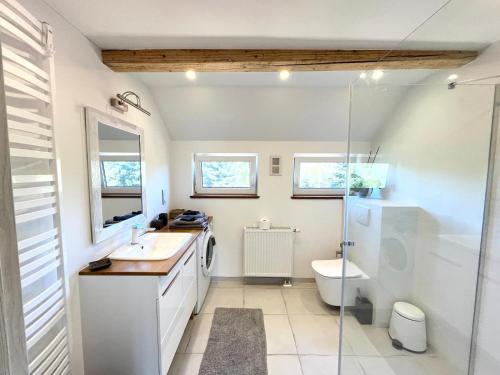 a bathroom with a sink and a toilet at Pod 20 in Jelenia Góra