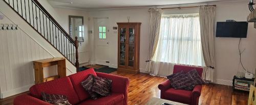 TV a/nebo společenská místnost v ubytování Eastham Cottage Betaghstown