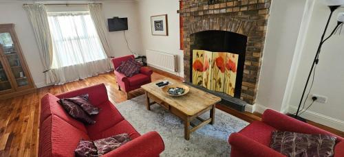 Posezení v ubytování Eastham Cottage Betaghstown