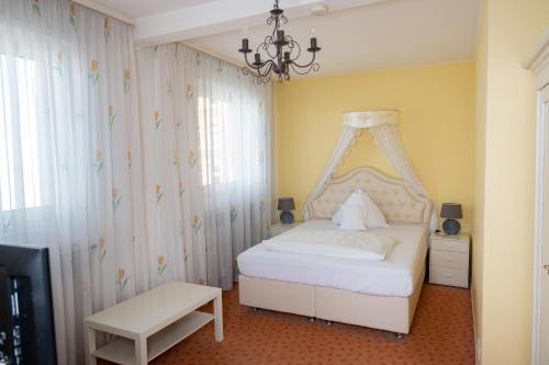 Ένα ή περισσότερα κρεβάτια σε δωμάτιο στο Hotel Alpha
