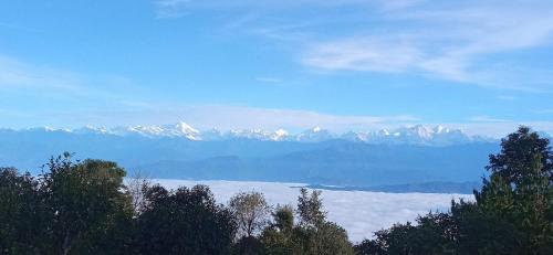 a view of a mountain range with snow covered mountains at Everest Home Stay Temal Kalimati Tower in Thapathali
