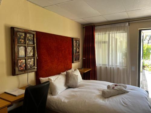 Postel nebo postele na pokoji v ubytování Matthys Guesthouse