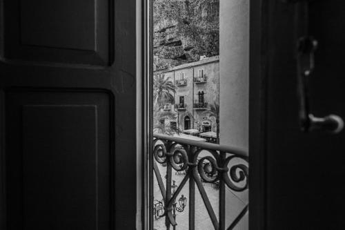 a view of a building from a window at Palazzo Villelmi in Cefalù