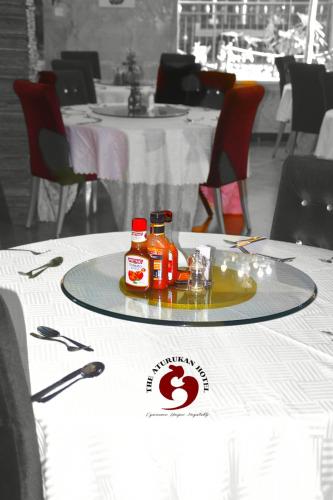 a tray with two bottles of hot dogs on a table at Aturukan Hotel in Kitale