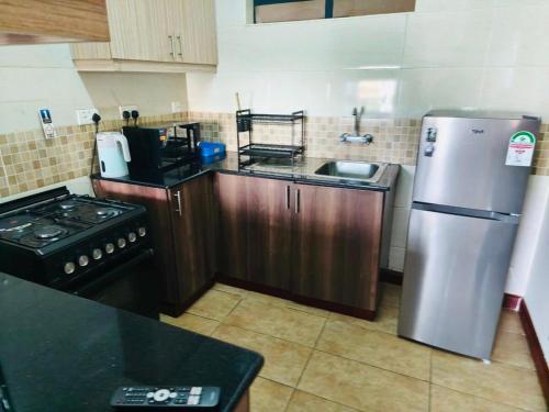 Η κουζίνα ή μικρή κουζίνα στο WPlace - Maggies Cozy Apartment