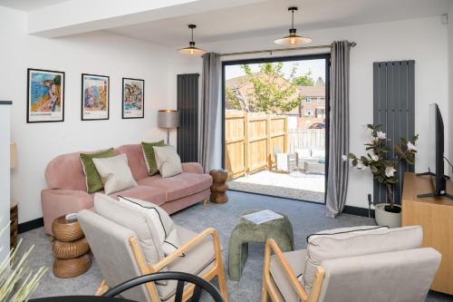 a living room with a couch and chairs at EightySix Bondgate by Harrogate Serviced Apartments in Ripon