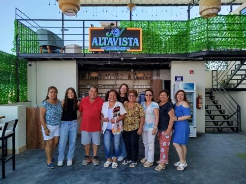 a group of people standing in front of a building at Hotel Konford Cañete in Imperial