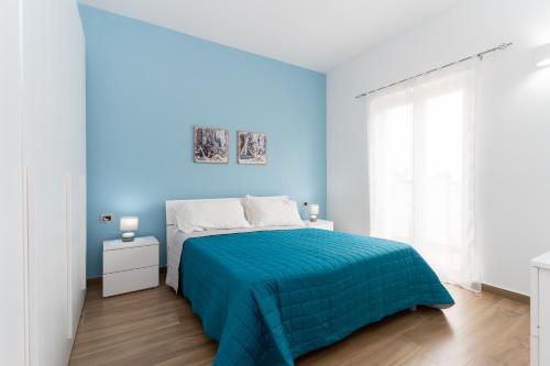 Postel nebo postele na pokoji v ubytování ApartHotel Capo Rizzuto