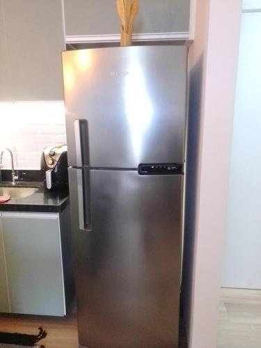 a stainless steel refrigerator in the corner of a kitchen at Piratininga - Niterói RJ in Niterói