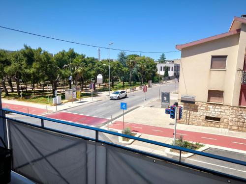 a view of a street with a car on the road at Faber Home in Conversano