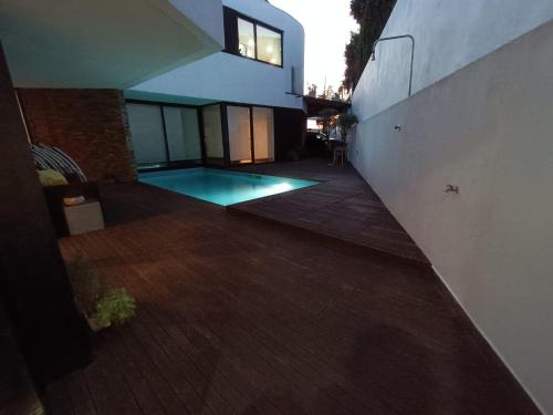 an image of a swimming pool in a house at Portugal Alma - Oporto Guesthouse in Ermesinde