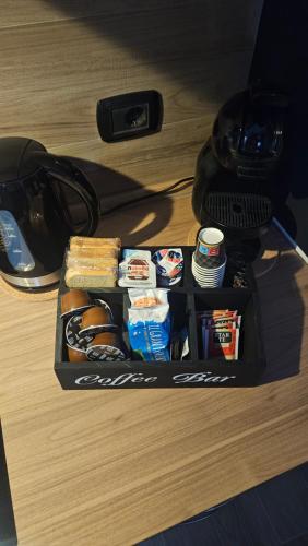 a lunch box with food and drinks on a desk at LORY ROOM vacation home in Quartu SantʼElena