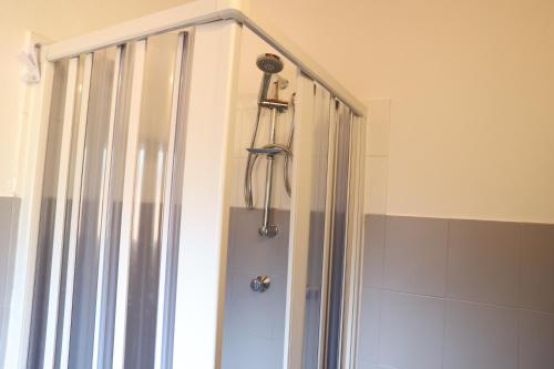 a shower in a bathroom with a shower head at Casa Ida in Sestri Levante