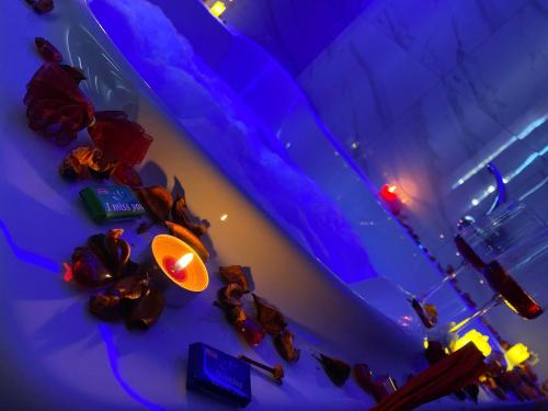 an overhead view of a room with blue lights and a table at Prenoćište SILVER LUX Srebrno Jezero 10 in Veliko Gradište