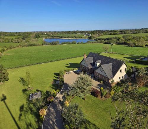 an aerial view of a large house in a field at The Starlings Country House in Wexford