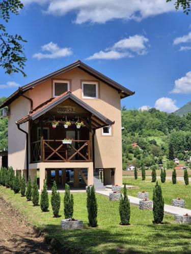 a large building with a gate in front of it at Drinski sjaj in Ljubovija