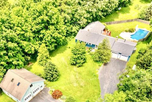 an aerial view of a house in the woods at HV Spacious Retreat sleeps 13 with pool and hot tub in Poughkeepsie