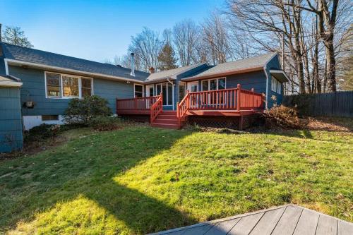 a house with a large yard with a deck at HV Spacious Retreat sleeps 13 with pool and hot tub in Poughkeepsie