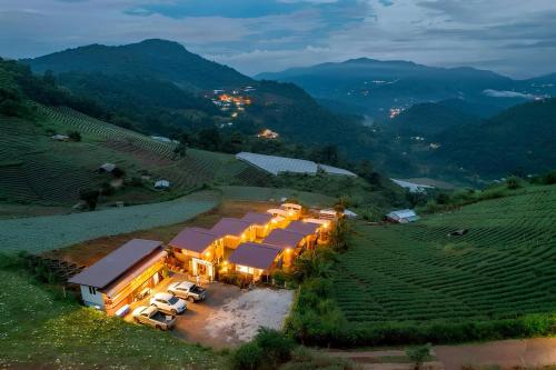 an aerial view of a winery in a vineyard at night at Koya Homestay โกญ่า โฮมสเตย์ in Mae Rim