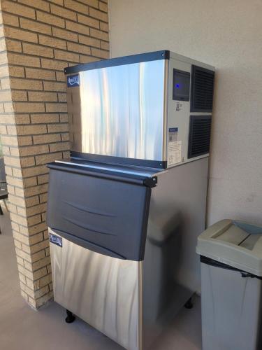 a microwave oven sitting next to a trash can at Aquarius Oceanfront Inn in Wildwood