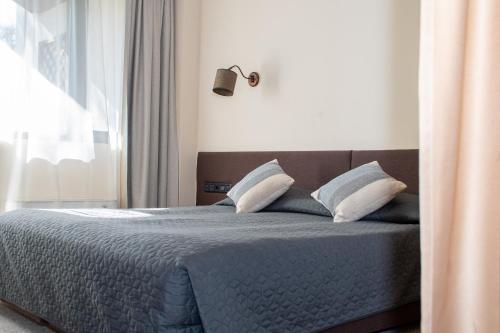 Ένα ή περισσότερα κρεβάτια σε δωμάτιο στο Hotel Orphey