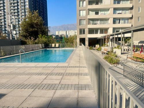 a swimming pool in the middle of a building at La Florida Mirador Azul 2 in Santiago