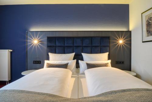 Cama o camas de una habitación en Hotel Seeblick Wismar