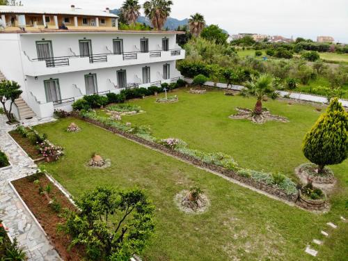 an aerial view of a building with a garden at Irene Studios in Arillas