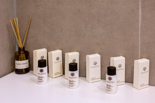 a group of five bottles of hair products on a counter at M4 Apartments in Freiburg im Breisgau