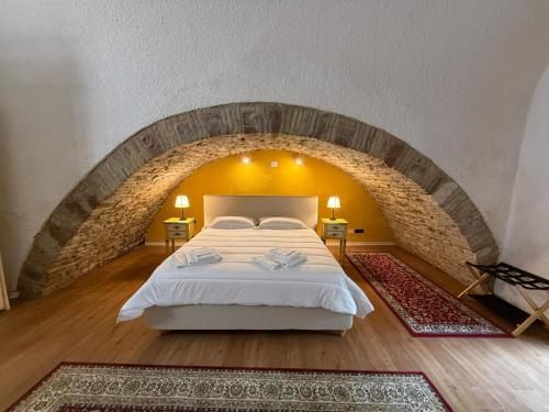 Кровать или кровати в номере Hotel Lieto Soggiorno