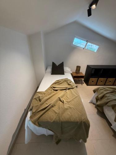 a bedroom with two beds in a room at Casa Mediterránea Gran Alacant in Gran Alacant