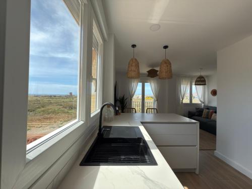 Kuchyň nebo kuchyňský kout v ubytování Apartamento La Gata del Cabo