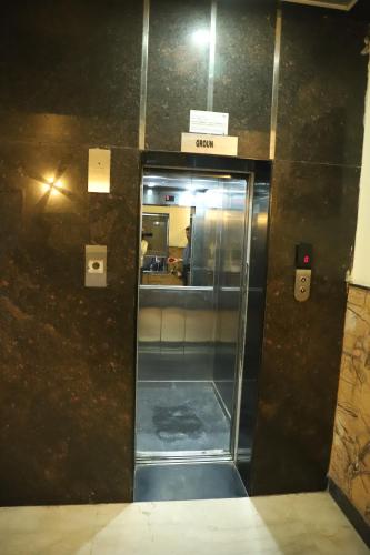 an elevator in a building with the door open at Hotel R K Palace - Simple Stay Royal Comfort in Jaipur
