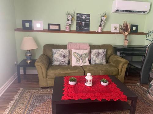 a living room with a couch and a table at 2 bedrooms home in Kentville in Kentville